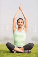 Focused sporty woman doing yoga