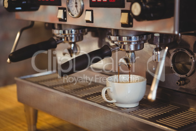 Machine making a cup of coffee