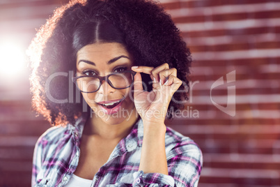 Attractive hipster posing with glasses