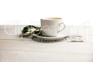 Cup of herbal tea on table