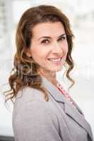 Casual businesswoman smiling to camera