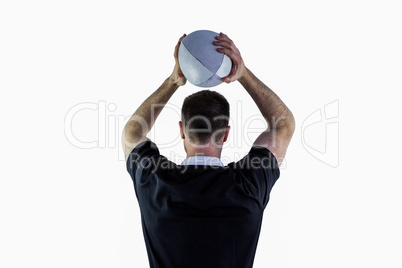 Rugby player about to throw a rugby ball