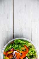 Healthy bowl of salad on table