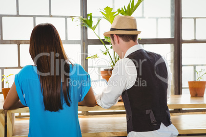 Cute couple sitting inside a cafe