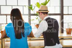 Cute couple sitting inside a cafe