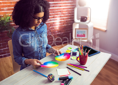 Casual businesswoman holding two color wheel