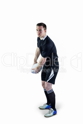 Rugby player about to throw a rugby ball