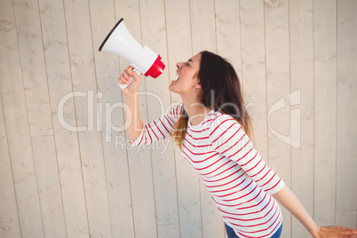 Pretty hipster shouting through megaphone