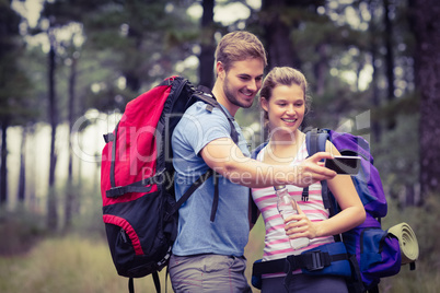 Young happy couple hiking in the nature