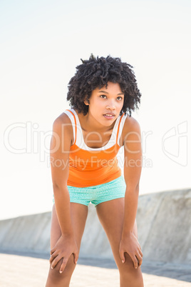 Breathing young sporty woman resting
