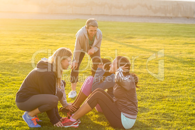 Sporty women doing sit ups during fitness class