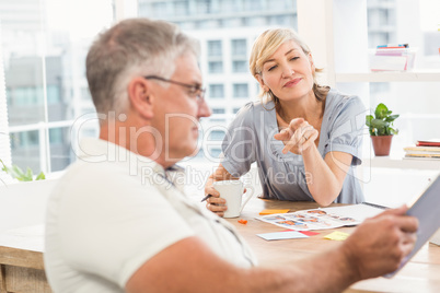 Businesswoman pointing at the tablet screen