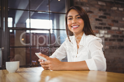 Casual businesswoman using her phones