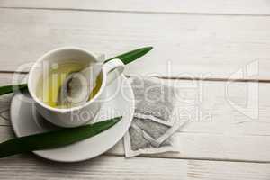 Cup of herbal tea on table