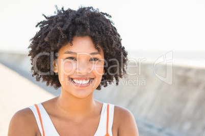 Young sporty woman smiling to camera