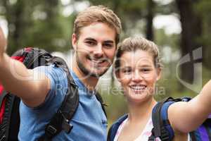 Young happy couple hiking in the nature