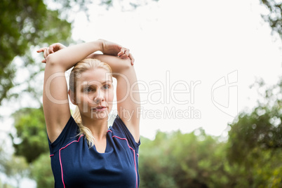 Athletic woman doing arms stretching