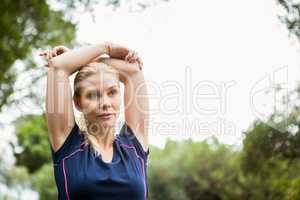 Athletic woman doing arms stretching