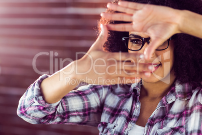 Attractive hipster taking picture with hands