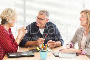 Smiling business team attending a meeting