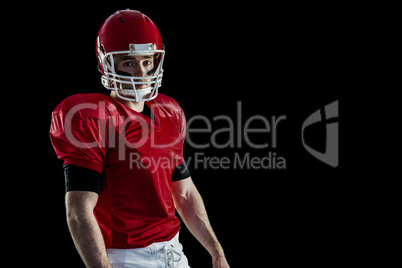 Portrait of american football player wearing his helmet