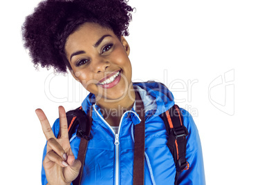 Young woman doing the peace sign