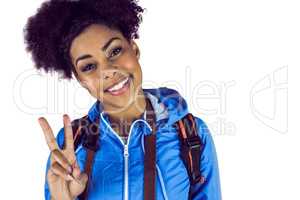 Young woman doing the peace sign