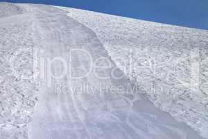 Ski slope at sun evening