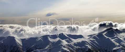 Panorama of evening mountains in clouds