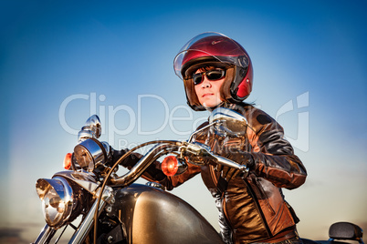 Biker girl on a motorcycle