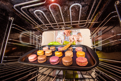 Baking macarons in the oven.