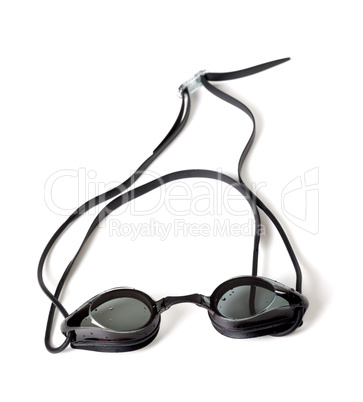 Wet goggles for swimming on white background.