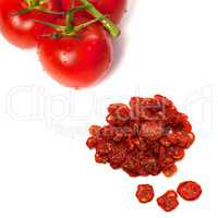 Ripe tomato with water drops and dried slices of tomato