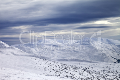 Winter mountains and gray sky