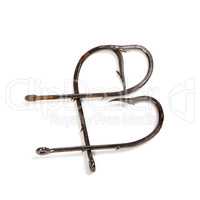 Letter B composed of old rusty fish hooks