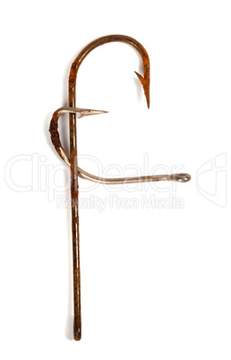 Letter F composed of old rusty fish hooks