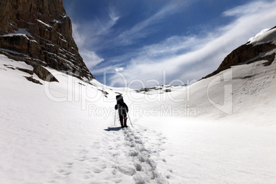 Silhouette of hiker on snow plateau