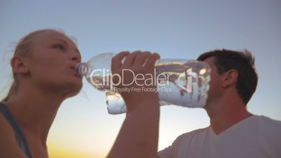 Couple Drinking Water after Exercises