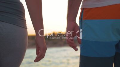 Couple walking outdoor holding hands