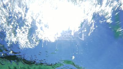 Sun reflection on wavy water surface