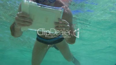 Man Shooting Coral Reef with Tablet PC