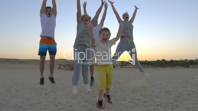 Happy jump of big family with child