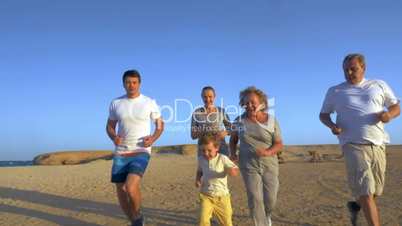 Big family jogging on the coast
