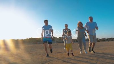 Family Jogging on the Beach