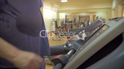 Man finishing his workout on treadmill