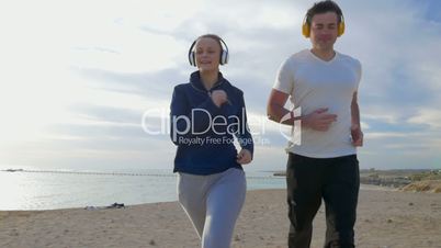 Couple Jogging on the Beach