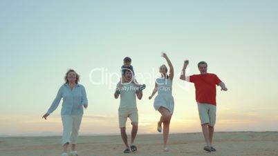 Enjoable family walk on the beach