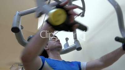 Man exercising on chest press machine