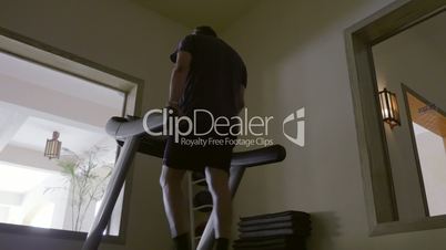 Man in the gym exercising on treadmill