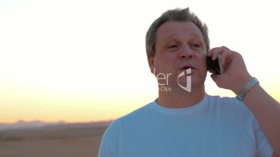 Man on vacation having a phone talk